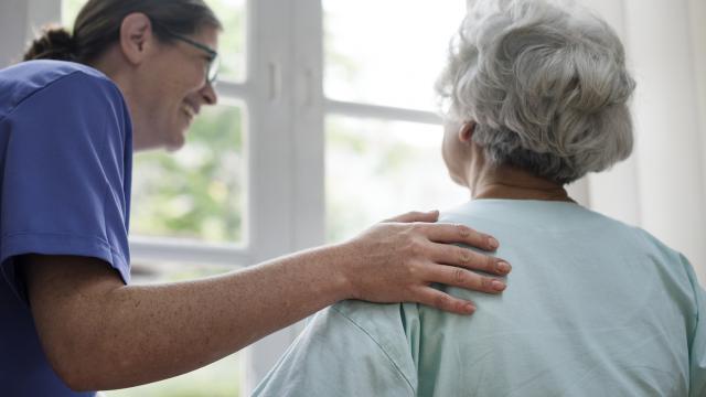 Nurse taking care of an old woman